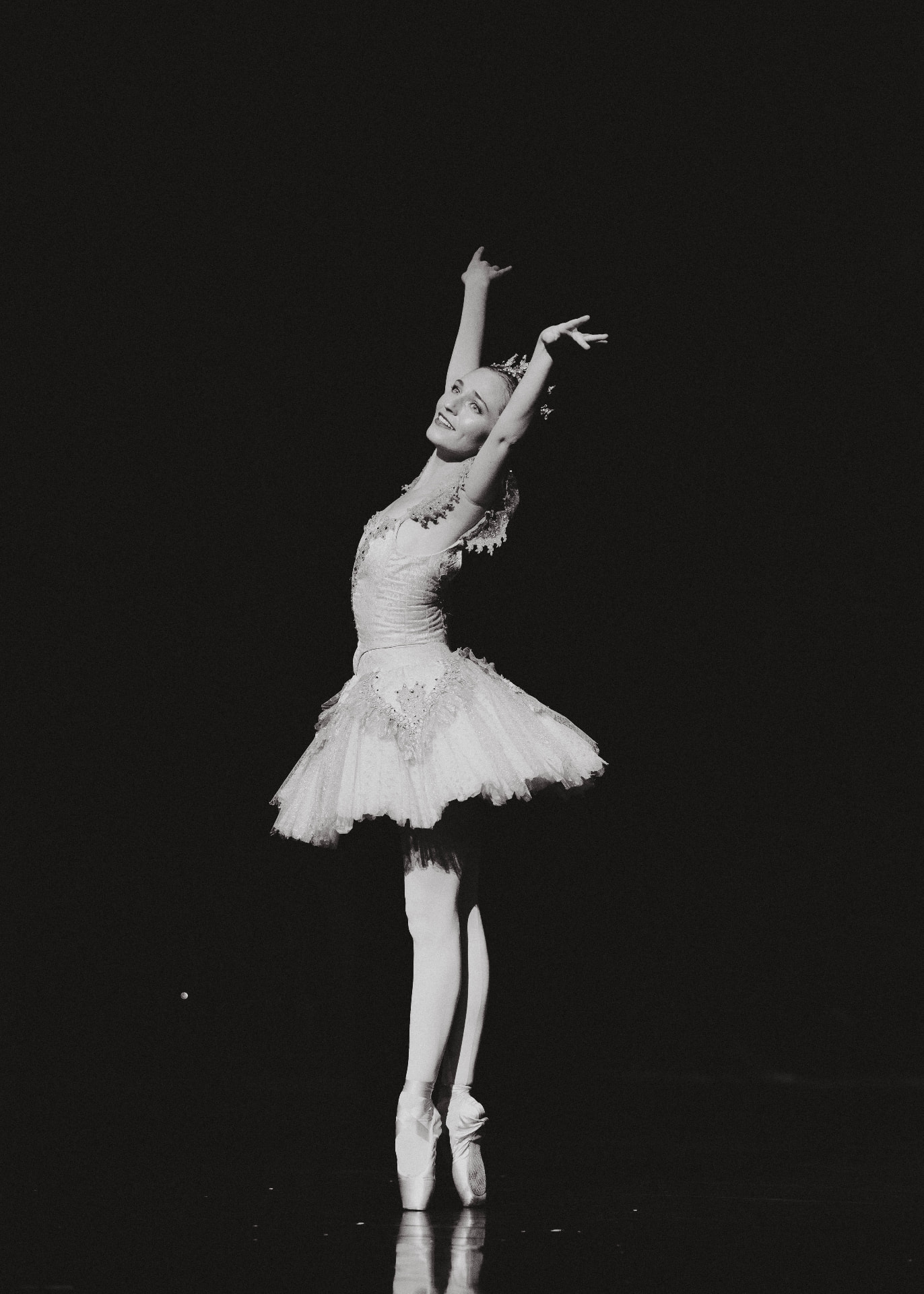 Miranda performing on pointe in a sparkling ballet tutu